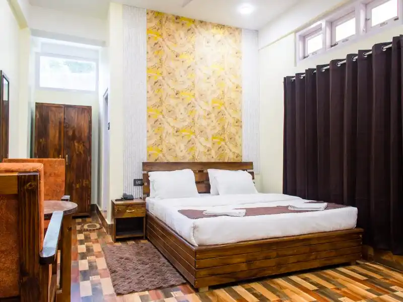 Deluxe Room at Hotel Nest Inn - Spacious accommodation with mountain views